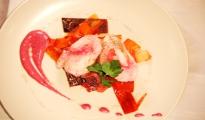 Pink and white fish ballotine with vegetable papillote and raspberry yogurt sauce